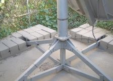 Base for a small VSAT satellite antenna