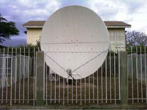 Customer antenna at VSAT site, with fence