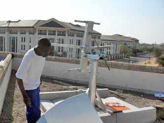 Preparing to attach the first half reflector panel