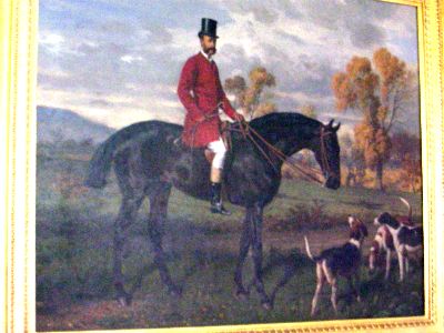 Painting of horseman with dogs