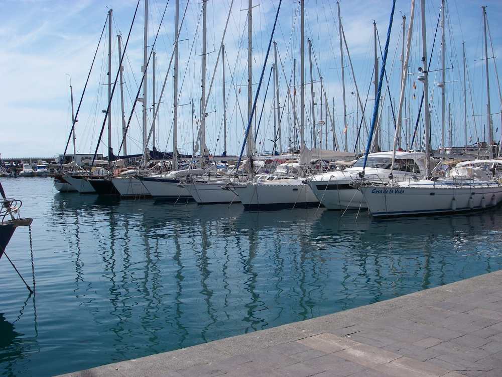 Puerto Mogan harbour with sailing yachts