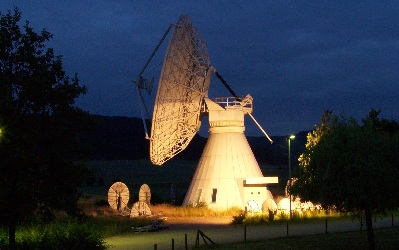 Large dish antenna at night