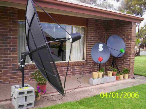 C band dish on a portable metal post mount pointing at INSAT 2E satellite to receive FTA TV channels from India