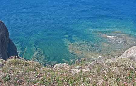 Looking down from the cliff of the headland, out to sea.