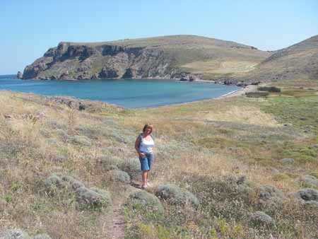 The hidden beach on the far side of the dip in the headland.