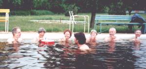 Drinking 'vitamins' in hot pool at Kunhegyes