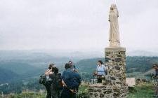 Walking along ridge above Monastier at Viewpoint with white statue