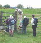 Climbing over high stile in the scottish deer fences.